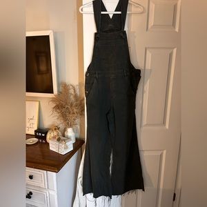 Aerie size small faded black overalls. Legs are Wide bottom and frayed hem.